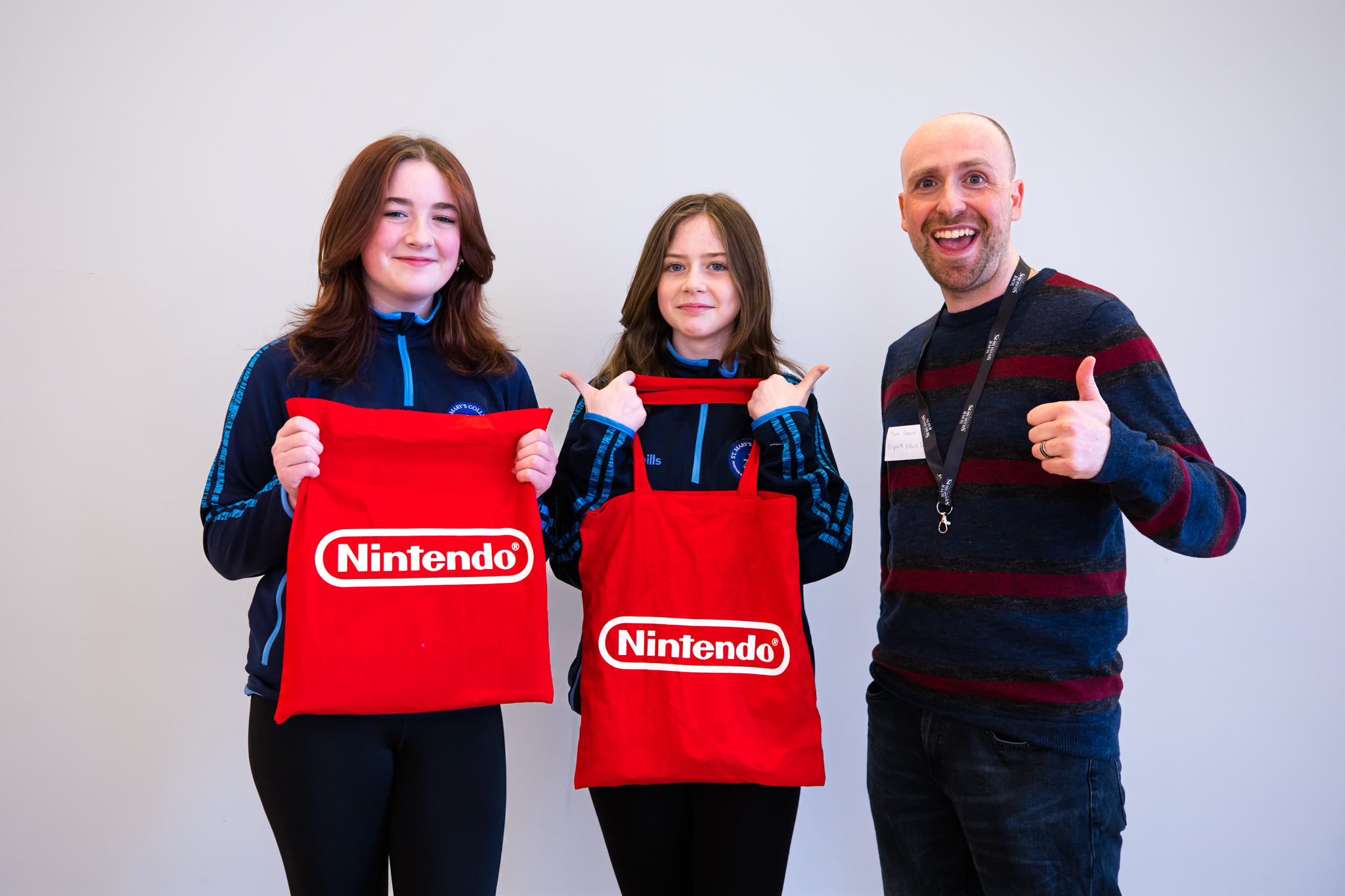 Erin and Orlaith show off their goody bags with Dom Sacco, who judged the competition and published the winning entry on Esports News UK.